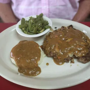 Smothered chop steak with brown gravy.