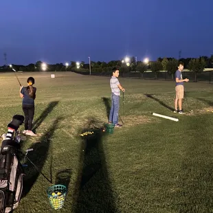 a group of people playing golf
