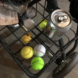 a cart full of golf balls