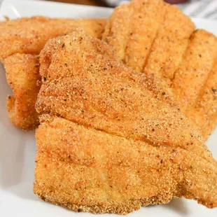 a plate of fried fish