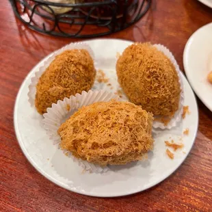 three muffins on a plate