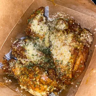 Garlic Parmesan w/lemon pepper sprinkled on it jumbled on top of the fries in a to go fries box