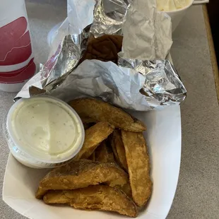 a basket of fried fish and chips