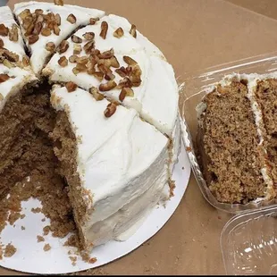 a carrot cake with a slice taken out of it