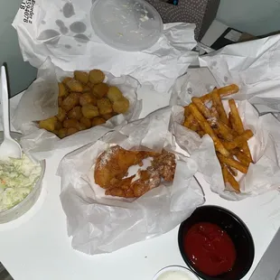 Fried okra, chicken tenders, Coleslaw, and Fries