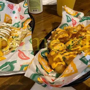 two hotdogs and fries
