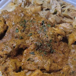 Jackfruit curry over rice with side of cabbage
