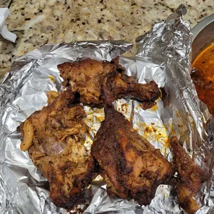 Had to finish cooking the chicken at home since it was undercooked. That's a leg and a chopped up thigh for $23!