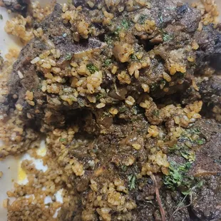 Jerk Ox-tails over fried rice.