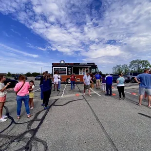 people standing in a parking lot
