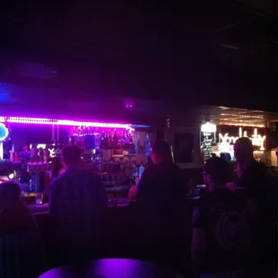 a crowd of people at a bar