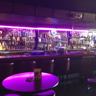 a bar with purple lighting