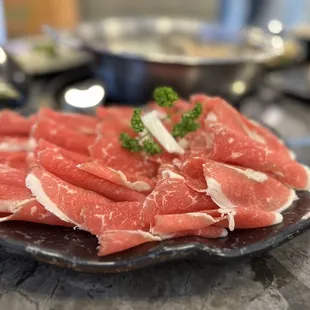 a plate of raw meat