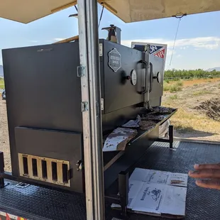 a bbq grill on the back of a truck
