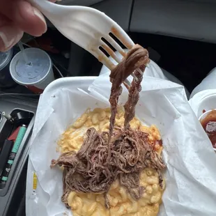 Brisket over Mac n cheese The Ju Ju