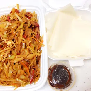 a meal in a styrofoam container