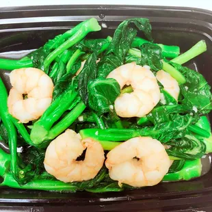 shrimp and broccoli in a plastic container