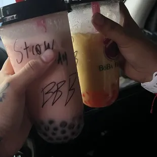 strawberry almond milk tea with blueberry boba &amp; mango coconut milk tea with cherry boba