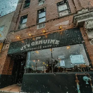 Picture of J.T.&apos;s Genuine Sandwich Shop on a rainy day.