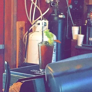 $6.50 Bloody Mary with celery, sriracha vodka, bacon, jalapeños, and a pickle. The bartender is GREAT!