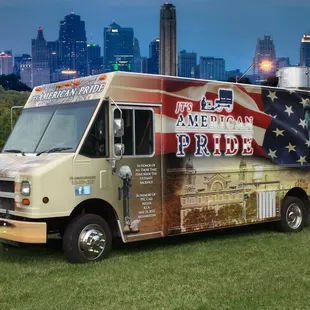 a food truck parked in a field