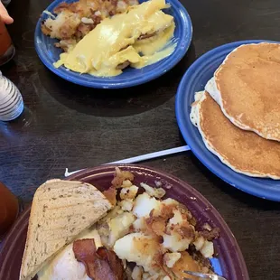 pancakes, eggs, hash browns, and pancakes