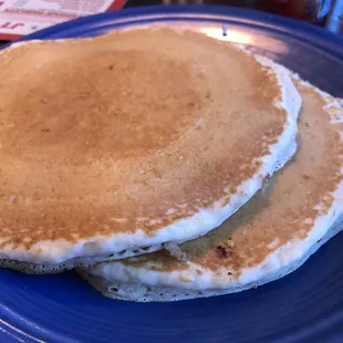 two pancakes on a blue plate