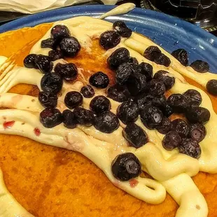 Holy pancakes Batman!!!  So damn delicious and bursting with almost a pint of blueberries.  And that cream on the top!!!