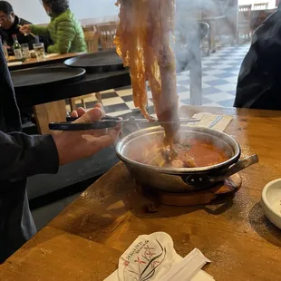 a person cooking in a restaurant