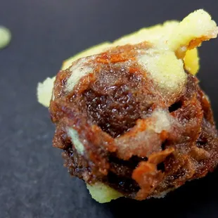 A Whole Li Hing Mui seed is packed in each Jui-Mui pop