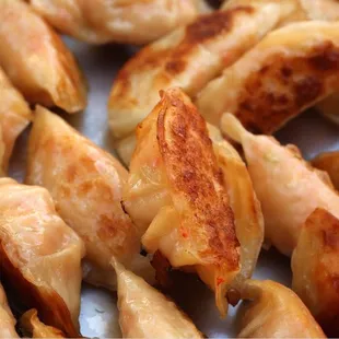 a closeup of a pile of dumplings