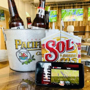 a beer and a cell phone