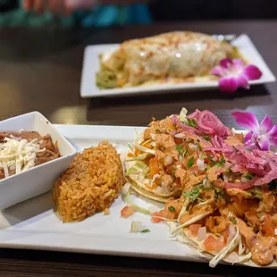 Shrimp tacos Baja style. Wet burrito in th back.