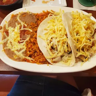 2 Fish Tacos $14.99. Served with rice and beans.  8/10/2021