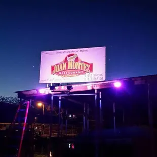 a billboard lit up at night