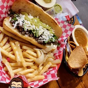  a table with a sandwich and french fries