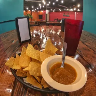  a plate of tortillas and a glass of beer