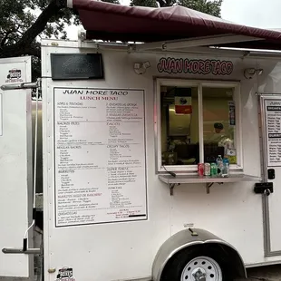 a food truck with menus