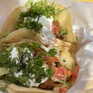 El pastor and Barbacoa taco add sour cream lettuce tomato