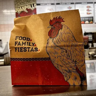 a paper bag with a chicken on it