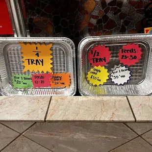 two trays of food on display