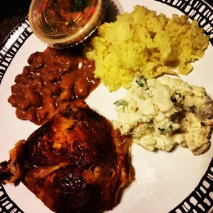 Rotisserie chicken, rice, potato salad and beans with hot salsa...