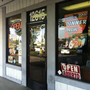 a restaurant window with a sign in the window