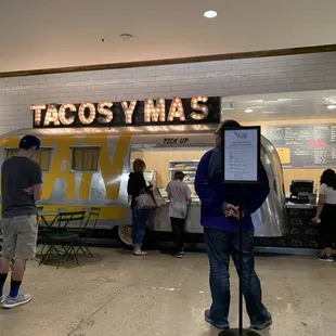 people standing in line at taco y wa's