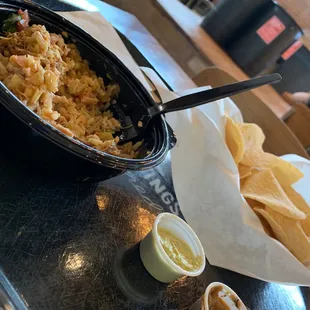 a bowl of rice and tortillas