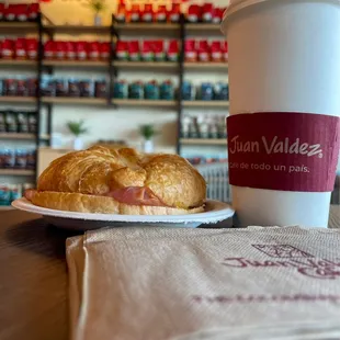 a sandwich and a cup of coffee