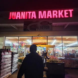 a man walking in front of the store