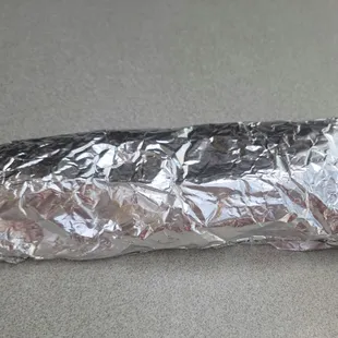 Juanita sells each burrito for $3, and they come nice and hot, fresh, and wrapped in foil.