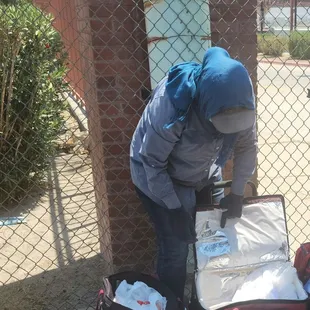 Juanita The Burrito Lady is working hard in 100-degree weather, selling us her burritos in El Paso, Texas.