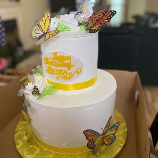 a cake with butterflies on top